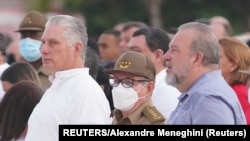 El dictador Miguel Díaz-Canel, el general Raúl Castro y el primer ministro Manuel Marrero en Cienfuegos el July 26, 2022. (REUTERS/Alexandre Meneghini).